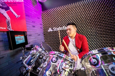 State Farm’s music-theme pop-up, which traveled to eight music festivals across the country last summer, encouraged fans to take a small action—through dancing, singing, performing, or listening—to support local organizations that give access to music education for underserved students. The pop-up, which was produced by the Marketing Arm, offered stations including a record store, a silent disco, and an infinity room-style recording studio. Every interaction in each station was converted into currency, with State Farm contributing as much as $500,000. Guests could test their drumming speed and agility playing a custom drum set, which was housed in a mini music venue.