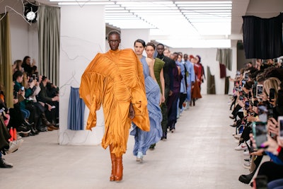 A model struts down the runway during the Richard Malone show in London in February, before the COVID-19 pandemic forced event cancellations.
