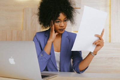 Woman In Blue Blazer Holding White Paper 3727468