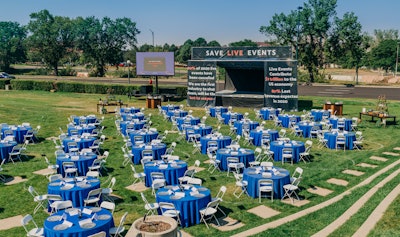 The set included all the elements that would go into a typical event, from the tables and chairs to the buffets, decor, staging, and audiovisual production—everything but the guests. Each empty table represented 250,000 live event professionals.