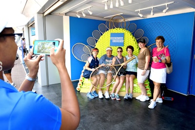 American Express’s 2018 fan experience featured interactive stations, photo ops, and an on-theme design. A playful photo area for fans was a branded Game of Thrones-inspired throne, created with tennis balls and golden tennis rackets.