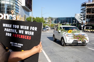 Due to local restrictions on live gatherings, event professionals were invited to show their solidarity in a car parade through Chick Hearn Court.