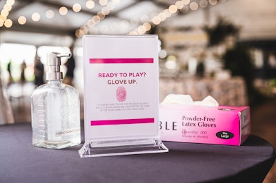 'Ponce City Market’s rooftop boasts so many interactive elements that we couldn’t resist incorporating a few,' Hlebec said. How to do this in a way that minimizes contact? A hand sanitizer and disposable glove station by the Cornhole setup.