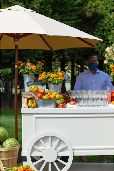 Bartenders donned masks for safety and spent the afternoon slinging summertime cocktails (think watermelon palomas and rose sangria) for the event's 13 guests. 'Safety was of tantamount importance,' noted Stark. 'All staff wore masks, from set-up through the event to the strike.'