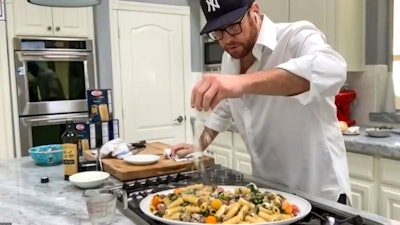 Scott Conant demonstrated how to make rigatoni with sausage, goat cheese, baby tomatoes, and spinach during a virtual class.