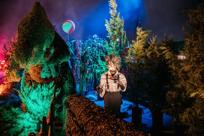 As cars made their way down the eerie, fog-filled 'haunted forest' path, they encountered living vignettes with actors depicting the likes of Edward Scissorhands, Carrie, and the masked killer from Scream.