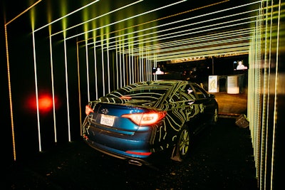 At the start of the event, guests drove through a custom-fabricated, LED wall tunnel while listening to a playlist curated by KCRW's Raul Campos.