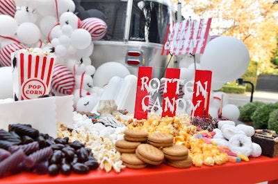 The team also set up a “rotten candy bar,” covered in plastic spiders and featuring on-theme snacks such as mummy-wrapped hot dogs. After dark, the family watched movies inside the airstream.