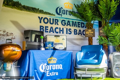 The prizes include a 70-inch TV, a wireless surround sound system, a football helmet throne, branded swag, an outdoor grill, a custom Corona Lime football trophy, and other goodies.