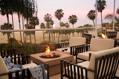 Firepits and blankets (like this setup at the Loews Santa Monica Beach Hotel) are a great way to keep guests warm at outdoor gatherings.