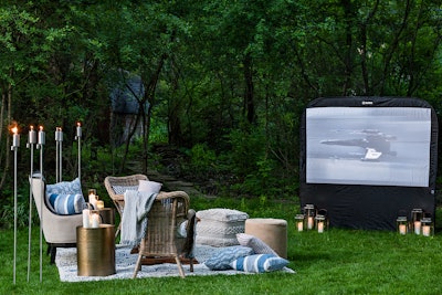 “HMR Designs’ ‘Hollywood at Home’ setup was *heart eyes!* In true 2020 fashion, the event design company constructed a movie screen and seating arrangement in an event host's backyard. While large-scale gatherings are on hold, this backyard movie affair is perfect for smaller, more intimate events.” –ST See more: Planning a Small Event at Home? Try These Turnkey Solutions for Decor, Catering, and More