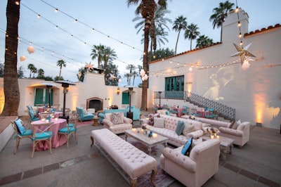 Outside of La Quinta Resort & Club, Los Angeles-based Iconic Event Studios brought in Revelry Event Design to outfit an outdoor event with blush tufted sofas.
