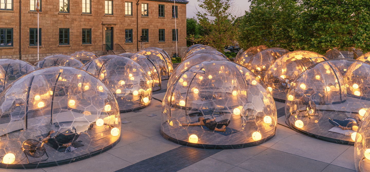 Caspian Agency's Heather Mason is inspired by a recent pandemic-friendly trend: clear bubbles. She imagines them set up along a parade route, with prime pods being reserved for frontline workers.