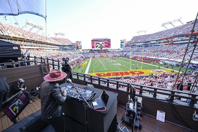 A costumed attendee wins a trip to the Super bowl American