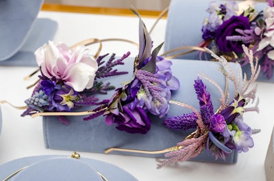 The floral and event design and production firm also makes whimsical floral accessories for guests to feel as if they’re attending one of Bridgerton’s costumed balls at London’s Vauxhall Palace Gardens. Accessories include ornate headbands, earrings, tiaras, necklaces and rings, and are sure to put guests in the Regency mindset.