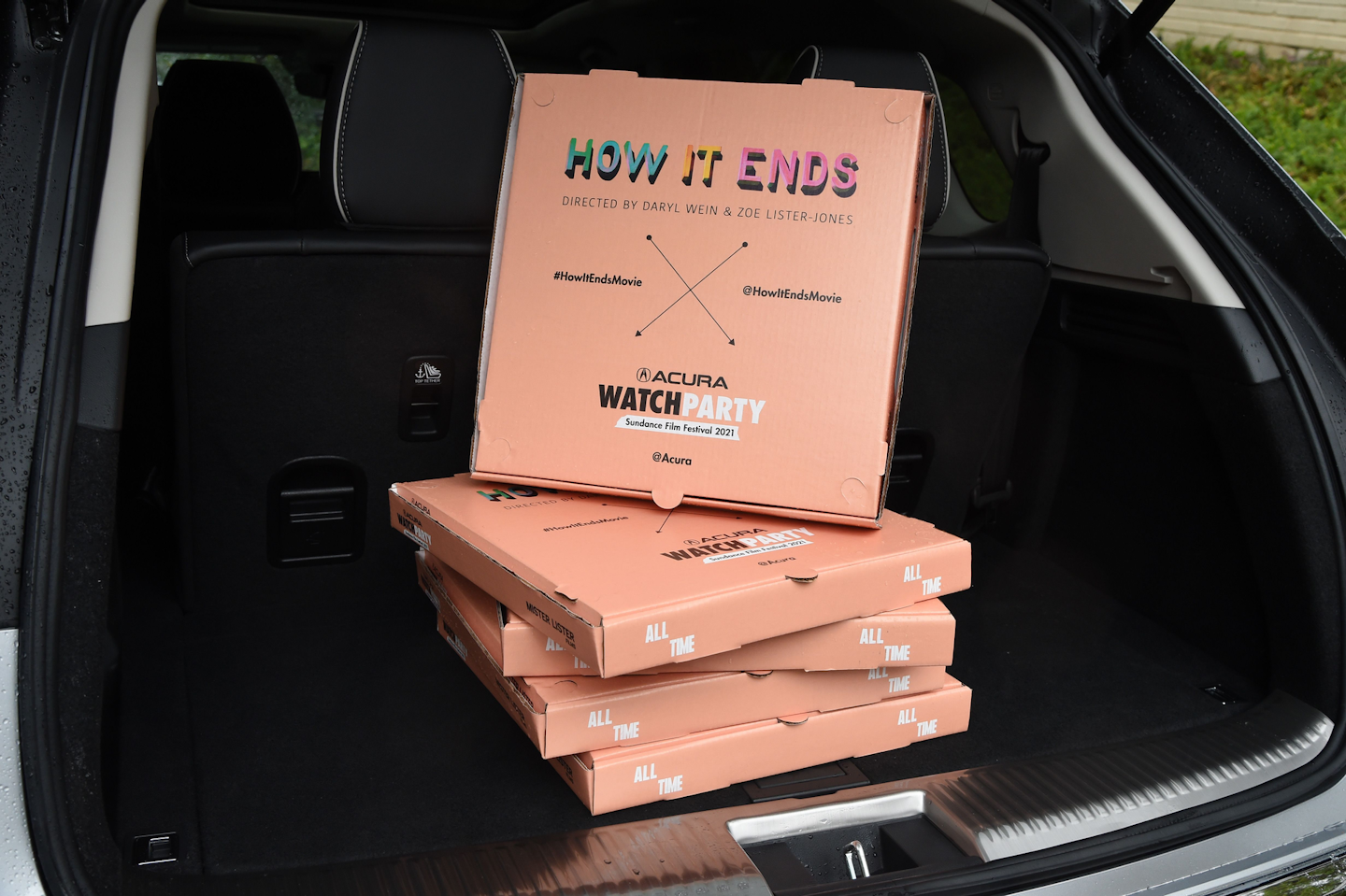 Zoe Lister-Jones and Daryl Wein delivered pizzas to the How It Ends cast and crew in the 2022 Acura MDX to celebrate the film's virtual premiere.
