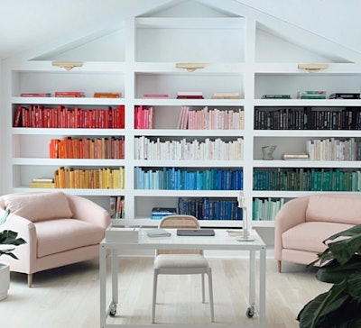 Jessica Boskoff has carefully curated her office to inspire her by hand-picking design books she can access and being in a bright, open space