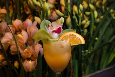 Springtime florals don't just stop at tablescapes and backdrops. Take, for example, the Chicago Botanic Garden's preview party for its Orchid Show in 2015. The evening's four-sided bar was positioned in the center of four giant planters with towering orchid displays. Additionally, orchids were also used to garnish the fruity cocktails that the bartenders poured that evening. See more: 10 Best Ideas of the Week: a Giant Lite-Brite, a Bread-Breaking Ceremony, Framed Floral Arrangements