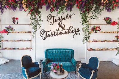At Be Inspired's 'Tassels & Tastemakers' event in 2016, flowers from the Hidden Garden decorated a lounge and hanging dessert display designed by A Good Affair. Vines trailed from the hanging display, and sprays of vibrant florals on the hanging shelves complemented the colors of detailed one-bite desserts from Beverly's Bakery. See more: 15 Beautiful and Surprising Ideas for Spring Flowers