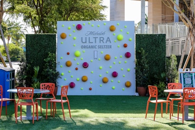 The Michelob Ultra Organic Seltzer Oasis includes a photo backdrop with colorful tennis balls.