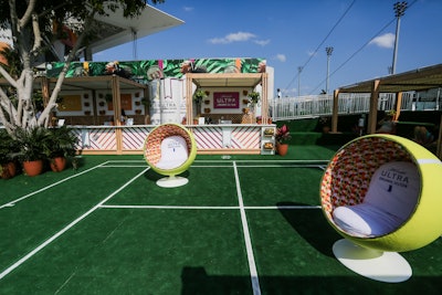 The Michelob Ultra Organic Seltzer Oasis features socially distanced chairs creatively spaced out on a mini tennis court.