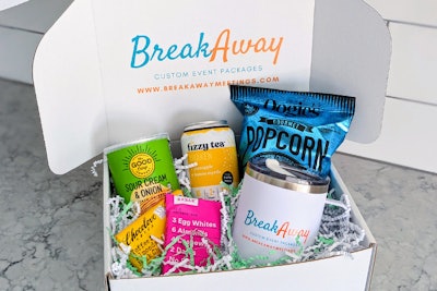 Example of a custom box created by BreakAway Meetings including craft snacks, beverages, and branded swag.