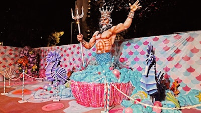 Under the sea, a large-scale Poseidon awaits, complete with oversize seashells, reflective flags and a massive fishing net that transports guests below sea level.