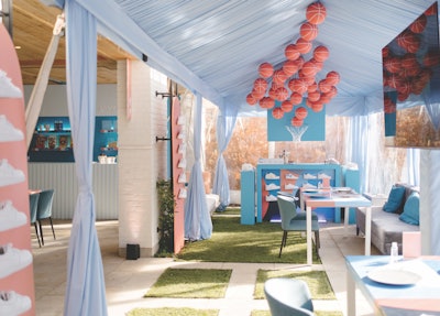 Toronto-based event design firm Megan Wappel Designs put a clever spin on traditional basketball decor with a pastel color palette and 40 hand-painted basketballs suspended over a custom-built shoe bar.