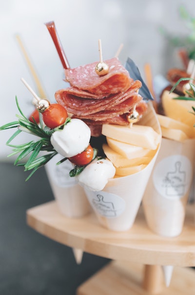 With social distancing in mind, Delaware-based The Cute in Charcuterie Co. is offering grab-and-go charcuterie-inspired cones packed with an assortment of crackers, nuts, meats, cheeses and more.