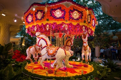 In 2013, the Wynn Las Vegas unveiled two floral installations conceptualized by Preston Bailey—a hot-air balloon and an animated carousel, which will live in the property’s atrium indefinitely. The installations were crafted by Wynn Design and Development and Forte Specialty Contractors. Constructed with a core made of fiber-reinforced plastic, the sculptures are adorned with more than 110,000 flowers, arranged in a vibrant color palette. The hot-air balloon stood 20 feet tall and weighed 4,000 pounds, while the carousel was 13 feet tall, 16 feet wide and weighed 6,000 pounds. Both installations featured theatrical lighting and were accompanied by festive music. Bailey said he looked to childhood inspirations to complement the existing whimsical theme of the Wynn atrium. See more: 9 Jaw-Dropping Floral Design Ideas for Spring