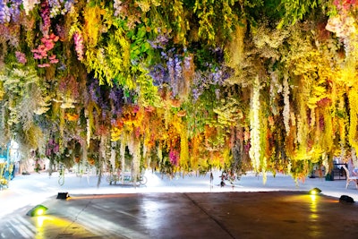 For the third annual Maison St-Germain (the brand’s summer solstice celebration) in New York in 2019, St-Germain debuted the meadow at Greenpoint Terminal Warehouse in Brooklyn. The meadow's “underbelly” featured FlowerCult's installation, which recalled previous Maison St-Germain events. Flowers and plants included light yellow achillea, dried light statice, white strawflower, Queen Anne’s lace, pink alliums, purple delphinium, fresh purple mist, eucalyptus and jasmine vine. See more: See How St-Germain Brought a Floating Meadow to Brooklyn