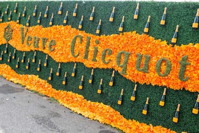 At the ninth annual Veuve Clicquot Polo Classic, which took place in June 2016 at Liberty State Park in New York, a floral wall used greenery to spell out the brand’s name and surrounded it with orange flowers and bottles of the Champagne. See more: 15 Fresh Ideas for Flower Walls