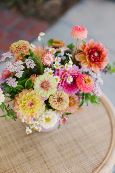 “Local garden roses, dahlias and zinnias are three of my favorites for the summer and can serve to anchor, elevate and unify even the most eclectic arrangements. I’m also very interested in incorporating fruits, veggies and unique textural elements in my designs this summer.” —Tabitha Abercrombie, owner and lead designer of Winston & Main Event and Floral Design Studio in Los Angeles