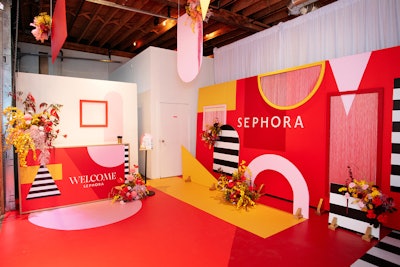 'Our team fell in love with the media branding for the event and knew we could get uber creative with it,' said producer Lynzie Kent of Love by Lynzie Events. The result was a colorful, maze-like pop-up with florals by Blush & Bloom, vinyls by Event Graffiti, and rentals by Divine Furniture Rental.