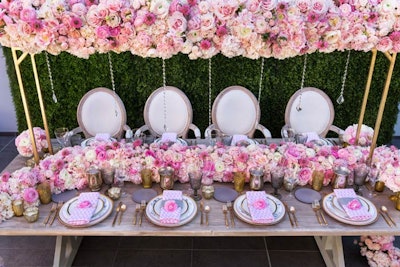 A tabletop design idea not meant for the faint of heart, this inspirational floral-clad tablescape was seen at Luxe Linen's Luxe Launch event in 2018. Celebrate Flowers and Invitations designed elegant pink and white florals for the table, and Luxe’s Pink Beads napkins completed the look. Recreating the scene at home or virtually? Opt for artificial flowers that can be shipped to family members for decorating their tablescapes without worrying about wilting blooms. See more: Get Inspired by 15 Colorful Twists on a Tropical Theme