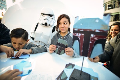At the Target and Star Wars Galactic Experience event in 2016, the brand worked with ad agency Deutsch for the public event that featured four domes with interactive experiences, character photo ops, a pop-up shop and other experiences. For an interactive component, guests could make their own Star Wars ornaments with the help of master origami folder Chris Alexander at the origami-building station—an activity easily scalable for at-home events!