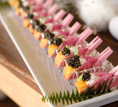 Elegant Affairs brought color—and clothespins—to its brunch bar. With many event organizers concerned about high-touch catering concepts amid COVID-19, these clothespins allowed guests to snag a bite without touching others on the plate!