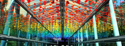 To commemorate the 49 victims of 2016's Pulse nightclub shooting in Orlando, the Orlando Science Center created a community art project called the “Love Bridge” to coincide with the one-year anniversary of the tragedy. Located at the venue’s Sky Bridge, the installation featured the seven colors of the rainbow in rows of four, with each row holding 49 origami hearts to represent the victims of the attack that targeted the LGBT community.
