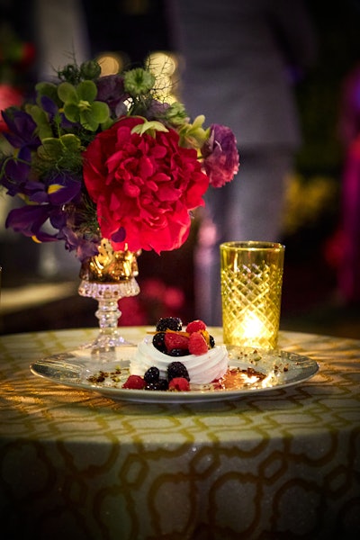 Red berry pavlova with strawberries and raspberries, crunchy meringue, whipped mascarpone, toasted pistachio and candied violets were served for dessert.