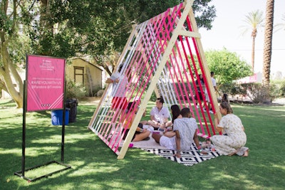 For a T-Mobile-sponsored pool party at Coachella 2018, Pandora and The Visionary Group created a series of colorful photo ops and seating vignettes, including custom ribbon tents stocked with branded pillows and graphic rugs.