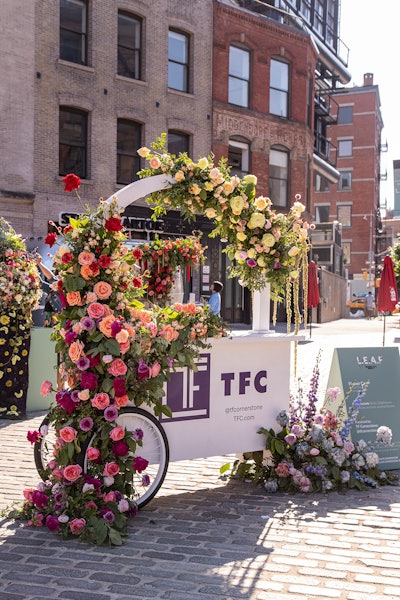 TF Cornerstone’s East Olivia-designed branded cart was parked in the center of the action. Free plant-a-pizza seed papers and tote bags were handed out to visitors.