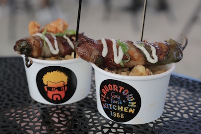 The BubbleQ host’s bacon-wrapped jalapeno poppers were served over mac and cheese in a cup featuring his face and logo from Guy Fieri’s Flavortown Kitchen.