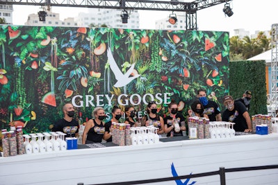 Face-masked Grey Goose bartenders served up featured cocktails in front of a tropical backdrop at Best of the Fest. The first 100 guests received reusable Grey Goose wine glasses.