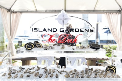 The Island Gardens ice sculpture at Sunset Happy Hour featured an array of oysters accompanied by Passmore Caviar.