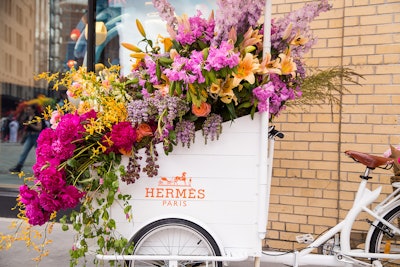 Hermès presented a decorated bike and cart, designed by Renny and Reed, at its storefront.