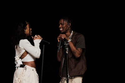 Shot on a beach in Santa Barbara, the virtual performance of American Express UNSTAGED with SZA and surprise guests Travis Scott and Isaiah Rashad aired on June 17.