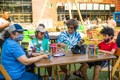 Attendees of all ages gathered to take part in scout-inspired activities such as friendship bracelet-making, inflatable archery, relay races, dance parties and, of course, cookie-eating.