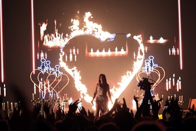 Singer Kasey Musgraves made a memorable debut at the VMAs for her first-ever live performance of “Star-Crossed.” She started the performance surrounded by glowing candelabras, before a giant heart was set on fire behind her during the song’s climax.