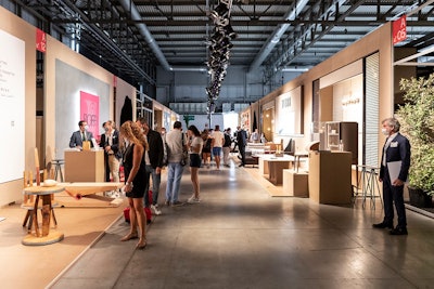 Rather than traditional exhibit booths, exhibitors presented their designs gallery style in long rows.