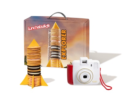 Each Lunchabuilds kit contains the popular snack, a blueprint, a themed 3D puzzle and an instant camera, plus an IRL experience. There are three different types of kits, 10 of each, including the Explorer Kit, a space-centric kit that features a real-life Space Camp experience at Camp Kennedy Space Center, Space Center Houston or Virginia Space Flight Academy; the Architect Kit includes a trip to an architectural wonder in the U.S. such as the Empire State Building, Space Needle or Gateway Arch; and the Biologist Kit comes with a visit to a zoo such as the San Diego Zoo, Bronx Zoo or Omaha Zoo.